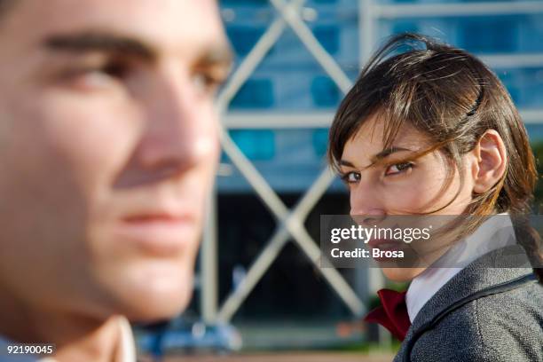 woman looking at a man with distrust - cruel stock pictures, royalty-free photos & images