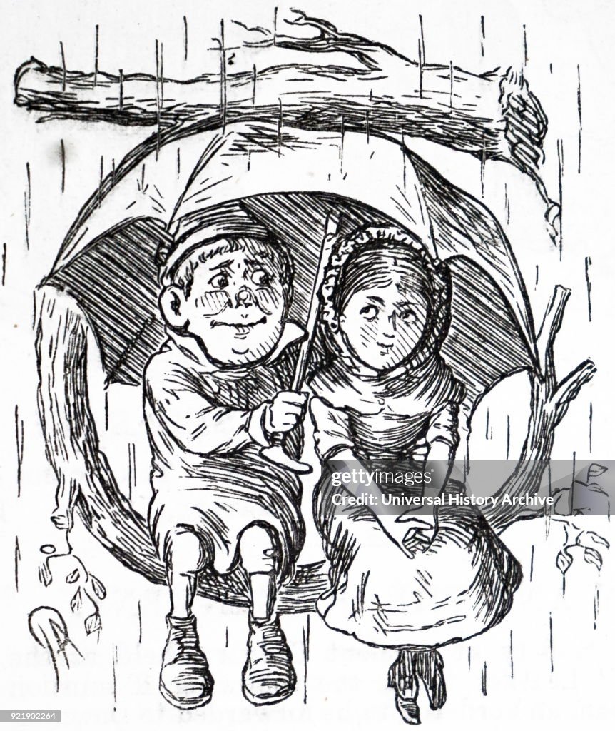 A young boy and girl sitting under his umbrella.