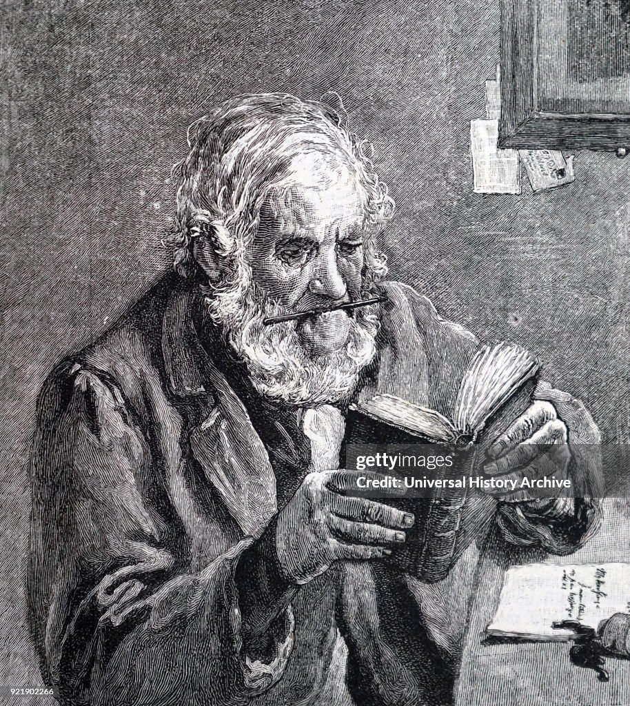 An elderly man using a dictionary.