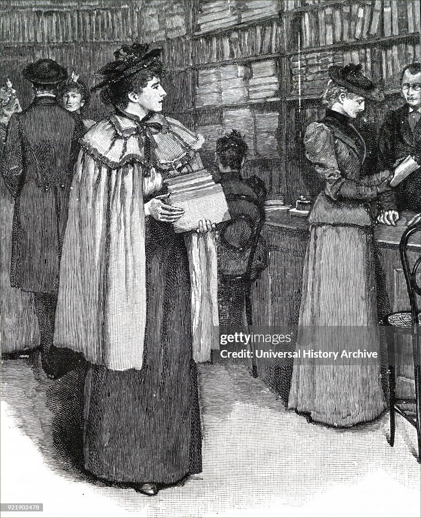 A woman buying books.