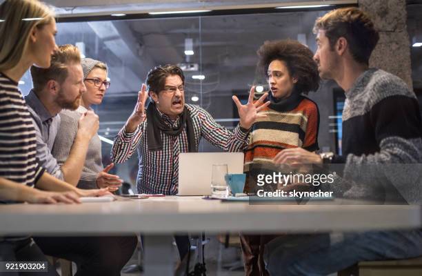 furious boss shouting at his team on a meeting in the office. - screaming stock pictures, royalty-free photos & images