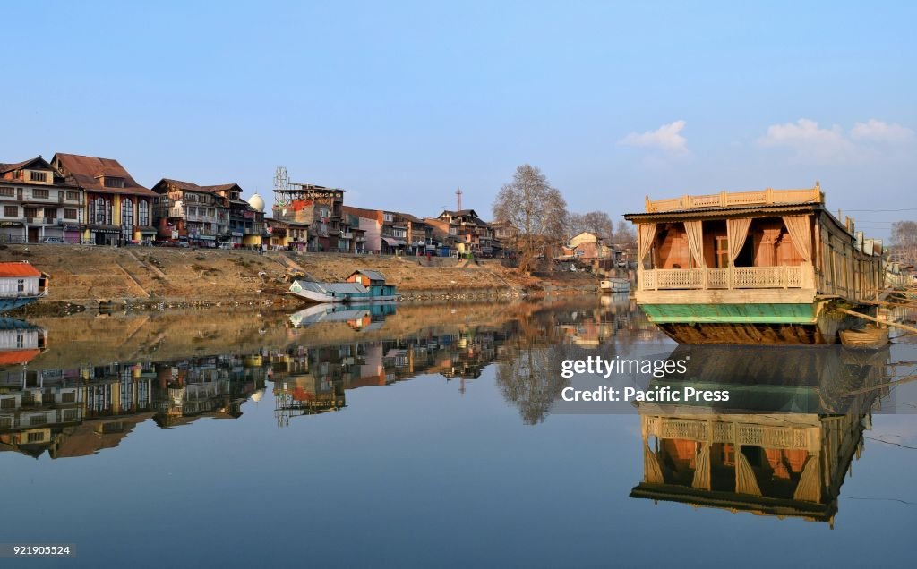 Reflection of a houseboat on the waters of river Jhelum in...