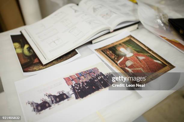 Copy of a painting of the funeral precession of Elizabeth I is seen, as members of the conservation team fit a 'pair of straight bodies' to the...