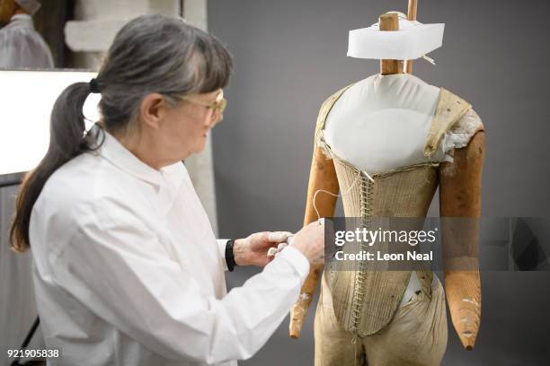 Costume historian Jenny Tiramani fits a 'pair of straight bodies' to the funeral effigy of Elizabeth I at Westminster Abbey on February 20, 2018 in...