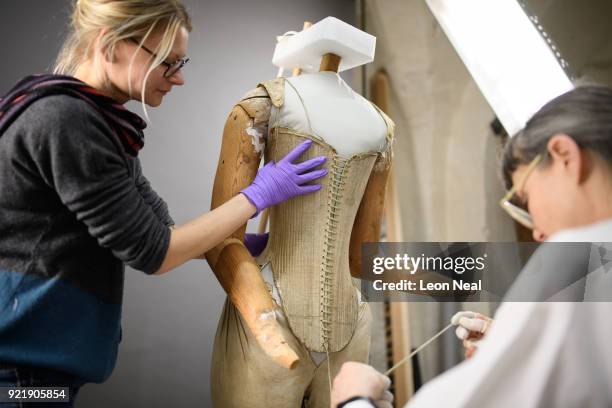 Costume historian Jenny Tiramani fits a 'pair of straight bodies' to the funeral effigy of Elizabeth I at Westminster Abbey on February 20, 2018 in...