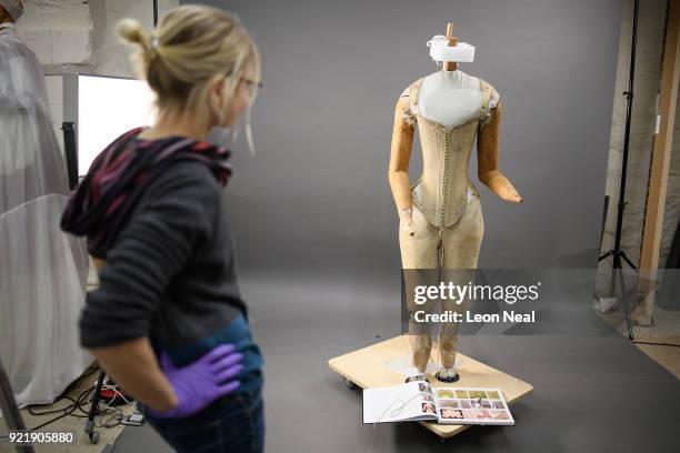 Member of the conservation team looks on during the fitting of a 'pair of straight bodies' to the funeral effigy of Elizabeth I at Westminster Abbey...