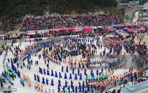 Miao people dance to the rhythm of music to worship ancestors and pray for good weather on the fifth day of the Lunar New Year on February 20, 2018...