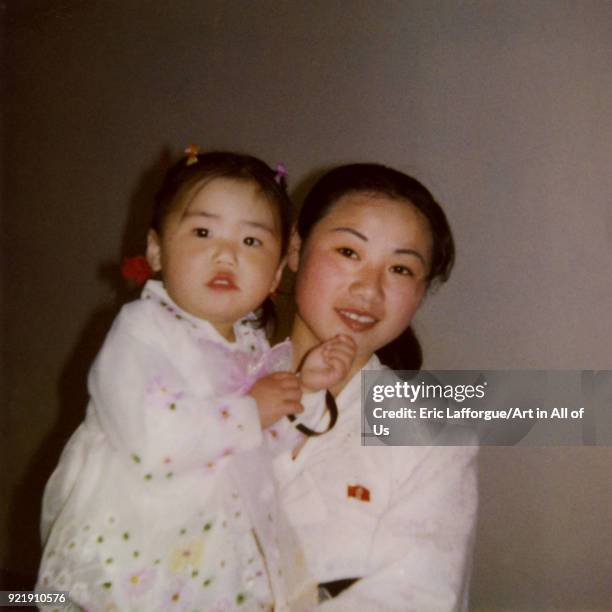 Polaroid of a nurse with a child, Pyongan Province, Pyongyang, North Korea on April 13, 2004 in Pyongyang, North Korea.