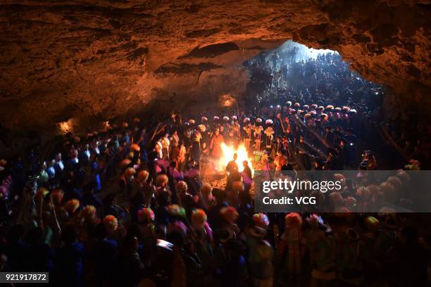 Miao people dance to the rhythm of music to worship ancestors and pray for good weather on the fifth day of the Lunar New Year on February 20, 2018...