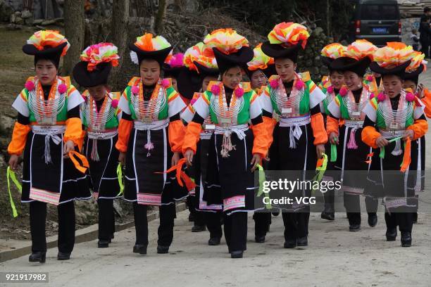 Miao people dance to the rhythm of music to worship ancestors and pray for good weather on the fifth day of the Lunar New Year on February 20, 2018...