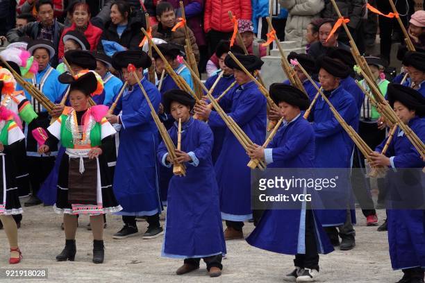 Miao people play Lusheng to worship ancestors and pray for good weather on the fifth day of the Lunar New Year on February 20, 2018 in Qiannan Buyei...
