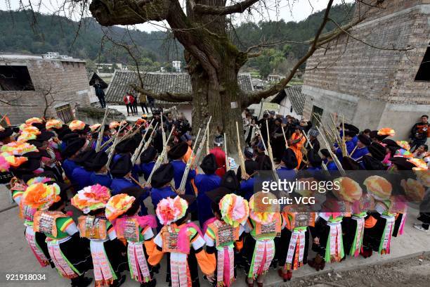 Miao people dance to the rhythm of music to worship ancestors and pray for good weather on the fifth day of the Lunar New Year on February 20, 2018...