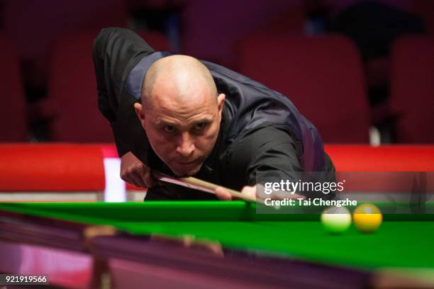 Joe Perry of England plays a shot during his first round match against Graeme Dott of Scotland on day two of 2018 Ladbrokes World Grand Prix at Guild...