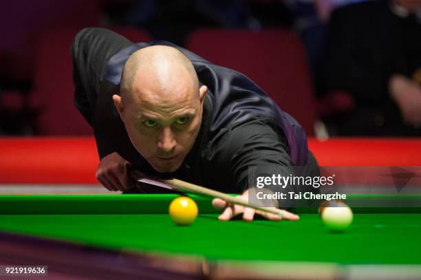 Joe Perry of England plays a shot during his first round match against Graeme Dott of Scotland on day two of 2018 Ladbrokes World Grand Prix at Guild...