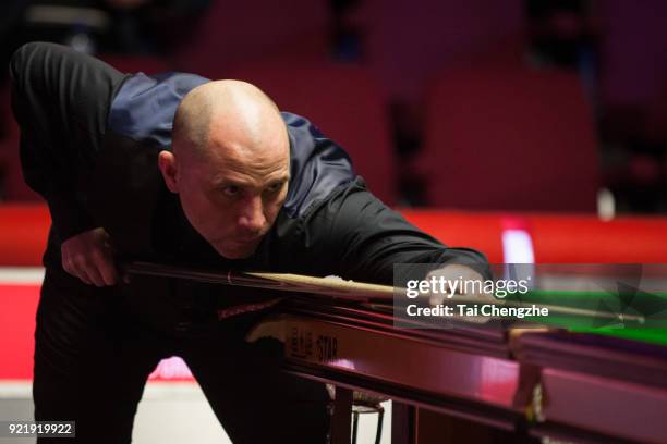 Joe Perry of England plays a shot during his first round match against Graeme Dott of Scotland on day two of 2018 Ladbrokes World Grand Prix at Guild...