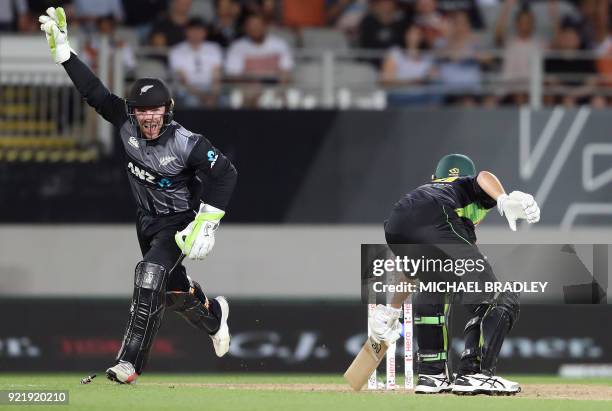 New Zealand's Tim Seifert celebrates taking the wicket of Australia's Ashton Agar during the final Twenty20 Tri Series international cricket match...