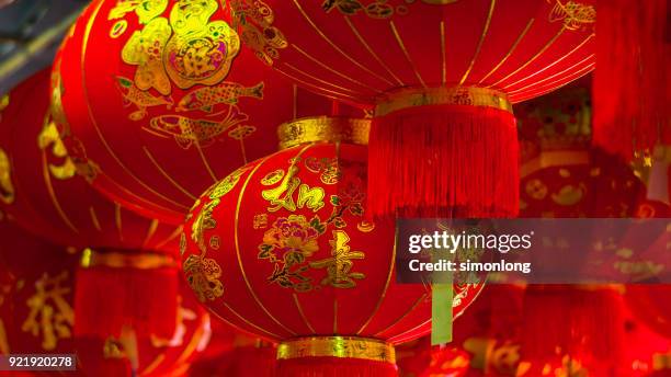 red lanterns hanging for sale during chinese new year - 2018 chinese new year stock pictures, royalty-free photos & images