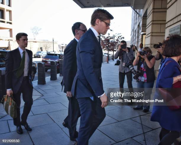 Attorney Alex Van der Zwaan, foreground in blue suit, arrives at US District courthouse in Washington, DC February 20 facing an indictment from...