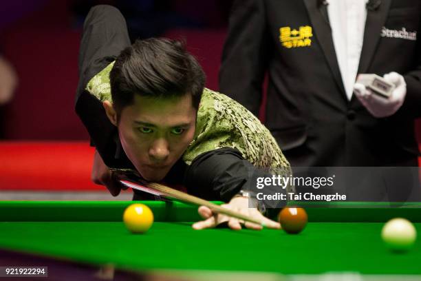 Cao Yupeng of China plays a shot during his first round match against Anthony McGill of Scotland on day two of 2018 Ladbrokes World Grand Prix at...