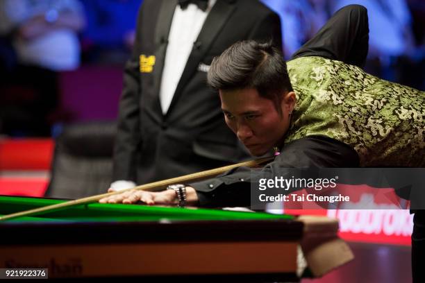 Cao Yupeng of China plays a shot during his first round match against Anthony McGill of Scotland on day two of 2018 Ladbrokes World Grand Prix at...