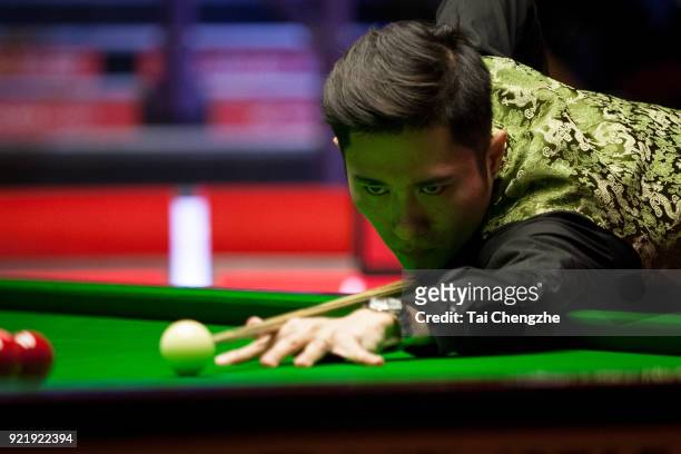 Cao Yupeng of China plays a shot during his first round match against Anthony McGill of Scotland on day two of 2018 Ladbrokes World Grand Prix at...