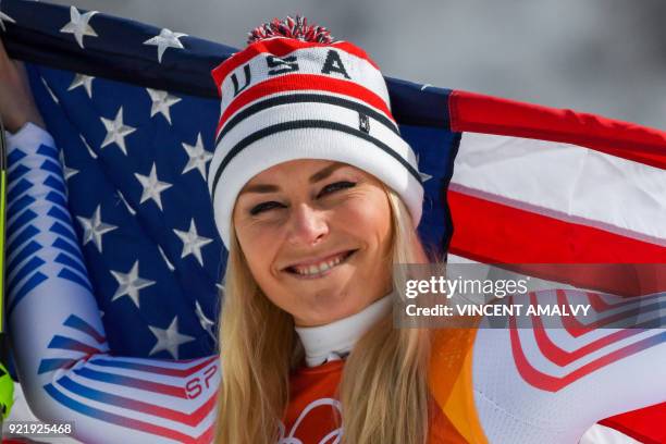 S Lindsey Vonn, third, celebrates during the victory ceremony of the women's Downhill at the Jeongseon Alpine Center during the Pyeongchang 2018...