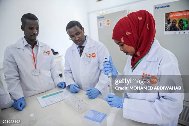 Photo taken on January 24 shows the laboratory technicians demonstrating DNA testing at the Puntland Forensic Center in Garowe, Puntland State,...