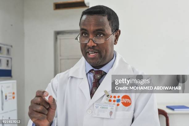 Photo taken on January 24, 2018 shows the Chief scientific officer Abdirashid Mohamed Shire speaking with his lab team at the Puntland Forensic...