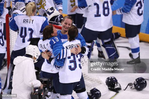 Riikka Valila, Isa Rahunen and Michelle Karvinen of Finland celebrate after defeating Olympic Athletes from Russia 3-2 during the Women's Ice Hockey...