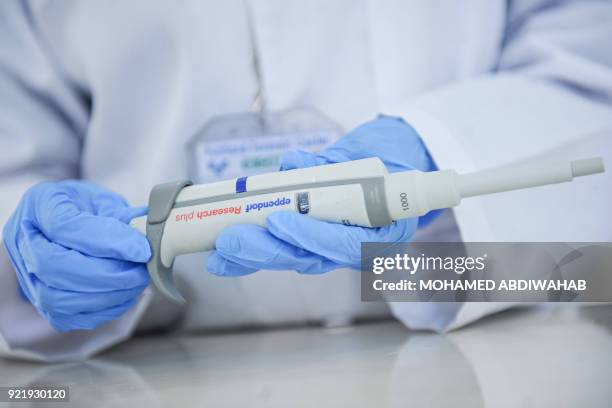 Photo taken on January 24, 2018 shows lab tecnicians demonstrating DNA testing at the Puntland Forensic Center in Garowe, Puntland State, Somalia. -...