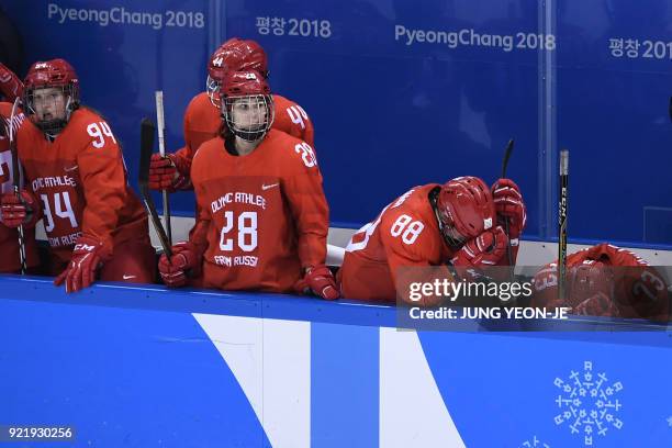 The Olympic Athletes from Russia's team reacts after losing the women's bronze medal ice hockey match between Finland and the Olympic Athletes from...