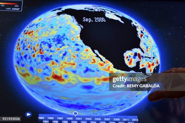 Researcher at the analysis centre of Mercator Oceans points at a screen images of ocean surveillance on December 7, 2017 in Toulouse. What is the...