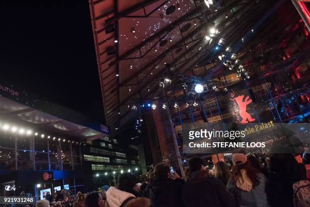 People wait in front of the Berlinale Palace before the premiere of his film "Don't Worry, He Won't Get Far on Foot" presented in competition during...