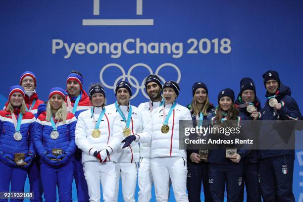 Silver medalists Marte Olsbu, Tiril Eckhoff, Johannes Thingnes Boe and Emil Hegle Svendsen of Norway, gold medalists Marie Dorin Habert, Anais...