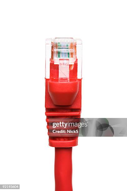 a close up of a red network connection cable - cable modems stock pictures, royalty-free photos & images