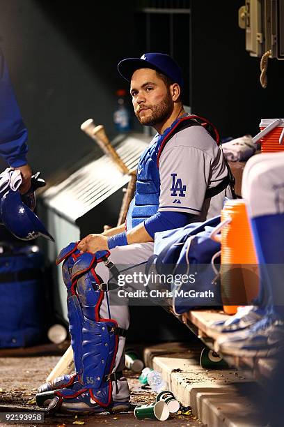 Catcher Russell Martin of the Los Angeles Dodgers sits dejected after losing 10-4 to the Philadelphia Phillies in Game Five of the NLCS during the...