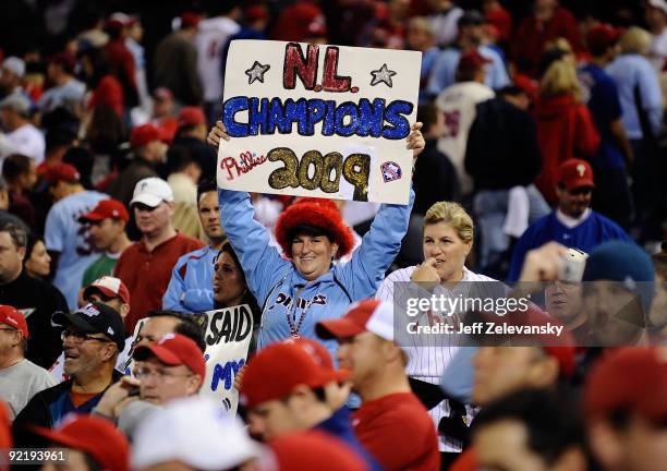 Fans celebrate the Philadelphia Phillies defeating the Los Angeles Dodgers 10-4 to advance to the World Series in Game Five of the NLCS during the...