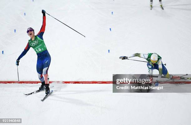 Jessica Diggins of the United States stretches across the finish line to win gold ahead of Stina Nilsson of Sweden during the Cross Country Ladies'...