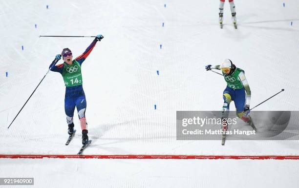 Jessica Diggins of the United States stretches across the finish line to win gold ahead of Stina Nilsson of Sweden during the Cross Country Ladies'...