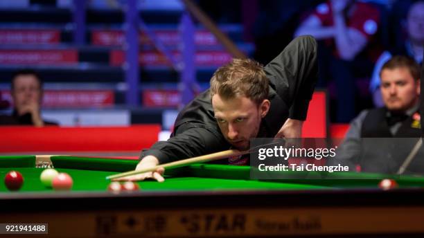 Judd Trump of England plays a shot during his first round match againstMichael White of Wales on day two of 2018 Ladbrokes World Grand Prix at Guild...