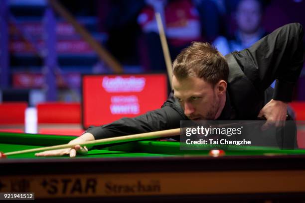 Judd Trump of England plays a shot during his first round match againstMichael White of Wales on day two of 2018 Ladbrokes World Grand Prix at Guild...