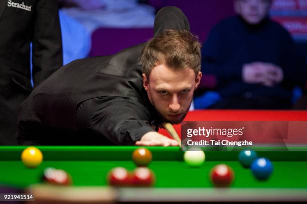 Judd Trump of England plays a shot during his first round match againstMichael White of Wales on day two of 2018 Ladbrokes World Grand Prix at Guild...