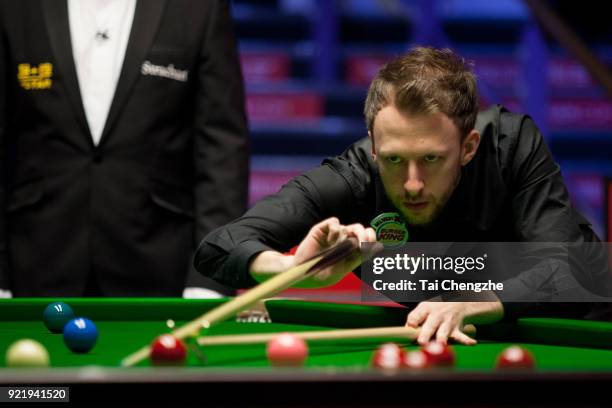 Judd Trump of England plays a shot during his first round match againstMichael White of Wales on day two of 2018 Ladbrokes World Grand Prix at Guild...