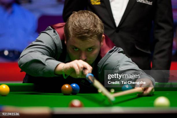 Michael White of Wales plays a shot during his first round match against Judd Trump of England on day two of 2018 Ladbrokes World Grand Prix at Guild...