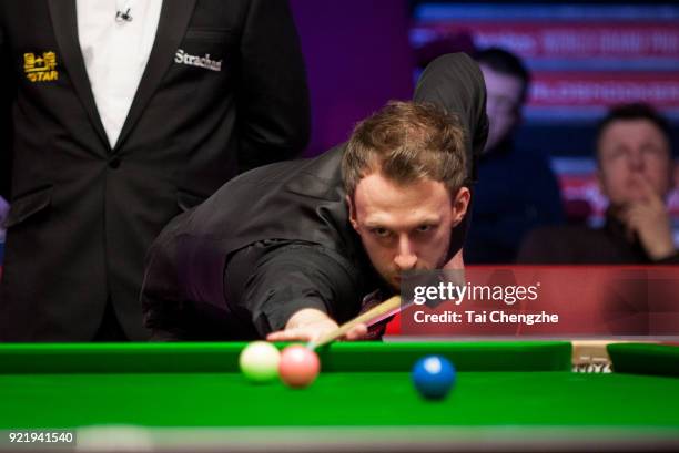 Judd Trump of England plays a shot during his first round match againstMichael White of Wales on day two of 2018 Ladbrokes World Grand Prix at Guild...