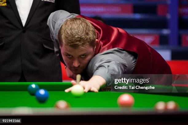 Michael White of Wales plays a shot during his first round match against Judd Trump of England on day two of 2018 Ladbrokes World Grand Prix at Guild...
