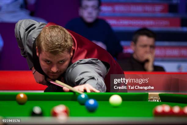 Michael White of Wales plays a shot during his first round match against Judd Trump of England on day two of 2018 Ladbrokes World Grand Prix at Guild...