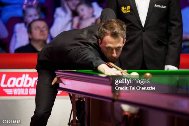 Judd Trump of England plays a shot during his first round match againstMichael White of Wales on day two of 2018 Ladbrokes World Grand Prix at Guild...