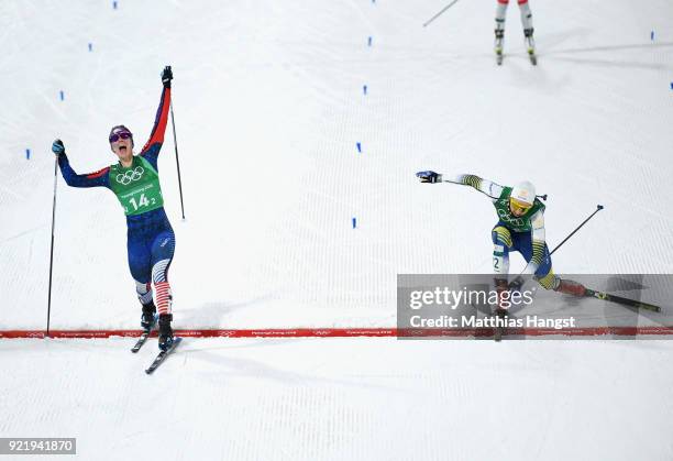 Jessica Diggins of the United States stretches across the finish line to win gold ahead of Stina Nilsson of Sweden during the Cross Country Ladies'...