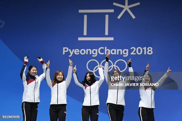 South Korea's gold medallists Shim Suk-hee, Choi Minjeong, Kim Yejin, Kim Alang and Lee Yubin pose on the podium during the medal ceremony for the...